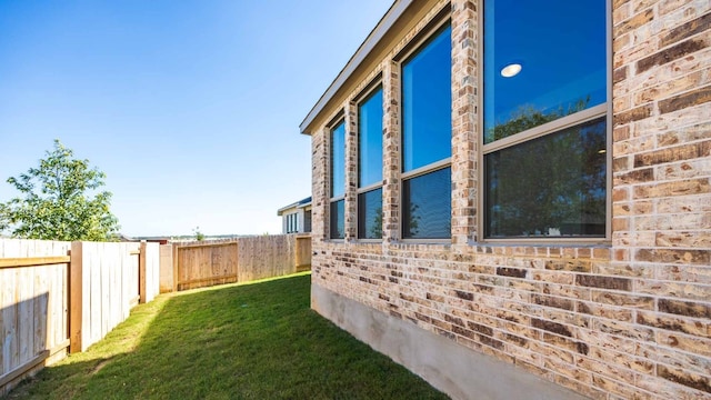 view of property exterior featuring a yard