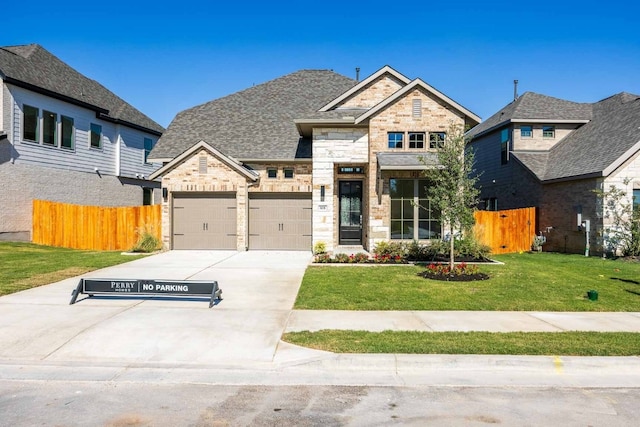 view of front of property with a front lawn and a garage