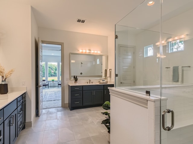 bathroom featuring vanity and tile patterned flooring