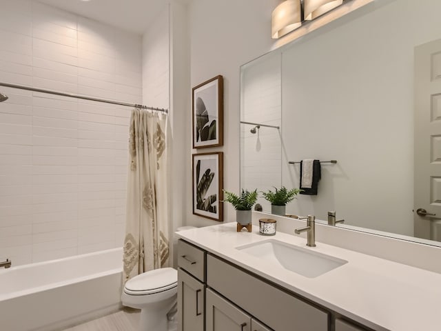 full bathroom featuring shower / bath combo with shower curtain, vanity, and toilet