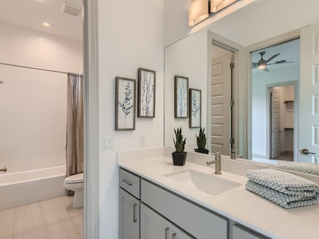 full bathroom with shower / tub combo, toilet, tile patterned flooring, ceiling fan, and vanity