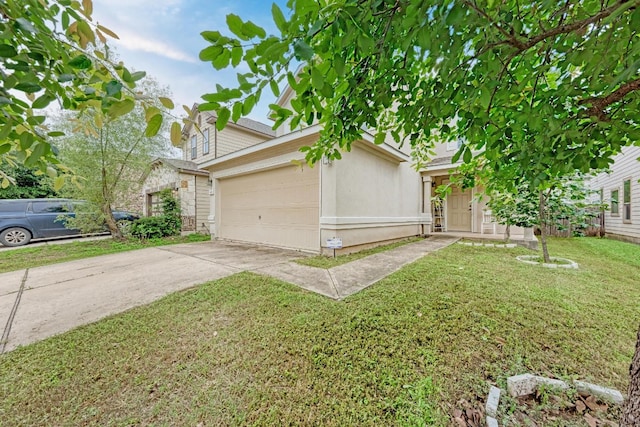 view of front of home featuring a garage and a front lawn