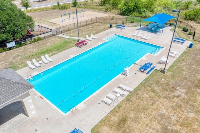 view of pool featuring a patio area and a lawn