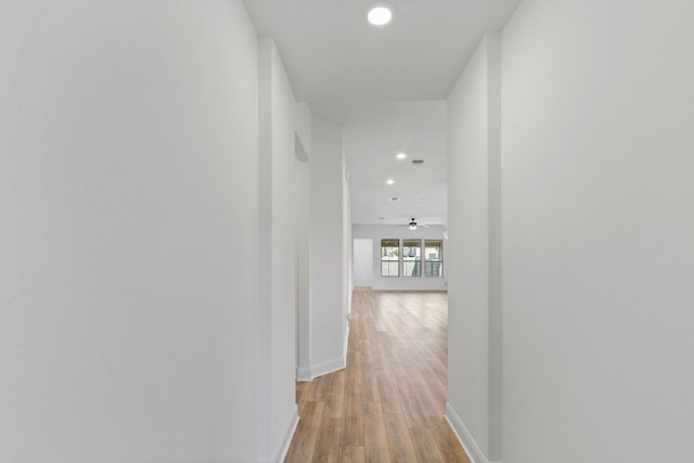 corridor featuring light hardwood / wood-style flooring