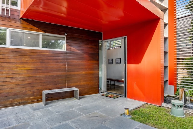 property entrance featuring a patio