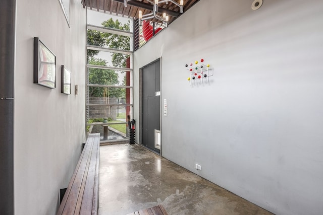 foyer with concrete floors and a wealth of natural light