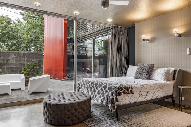 704 W Live Oak St, Austin, TX 78704 - bedroom featuring access to outside, concrete flooring, expansive windows, and ceiling fan
