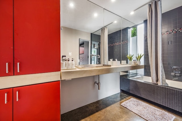 704 W Live Oak St, Austin, TX 78704 - bathroom featuring tiled shower / bath combo, concrete flooring, and recessed lighting