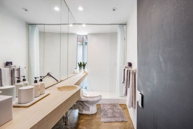 704 W Live Oak St, Austin, TX 78704 - bathroom with toilet, a shower stall, and recessed lighting
