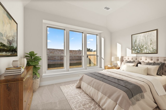 carpeted bedroom with lofted ceiling