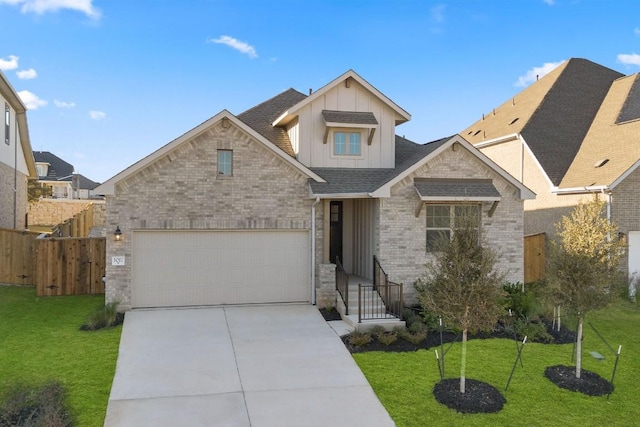 craftsman-style house featuring a garage and a front lawn