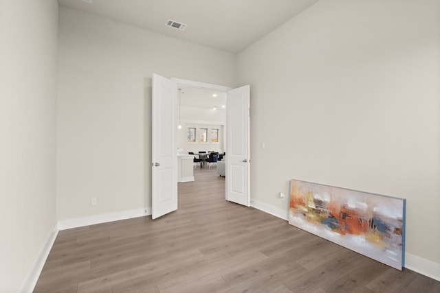 spare room with light hardwood / wood-style flooring