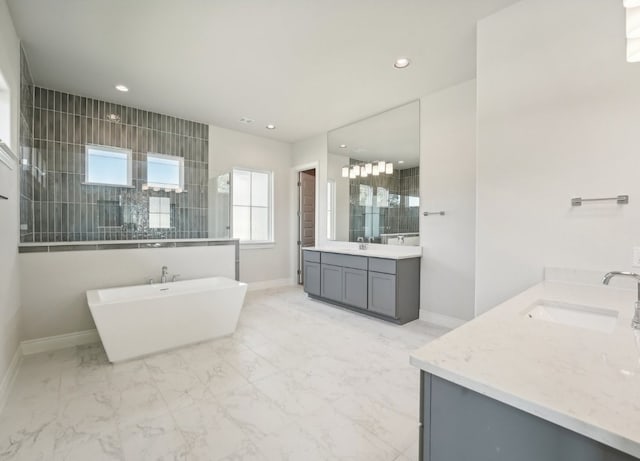 bathroom featuring plus walk in shower and vanity