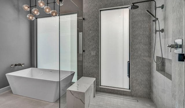 bathroom featuring tile patterned flooring and plus walk in shower