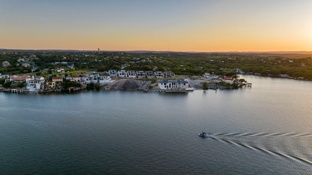 aerial view at dusk with a water view