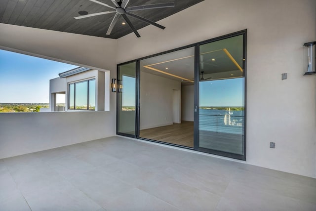 view of patio / terrace with a balcony and ceiling fan