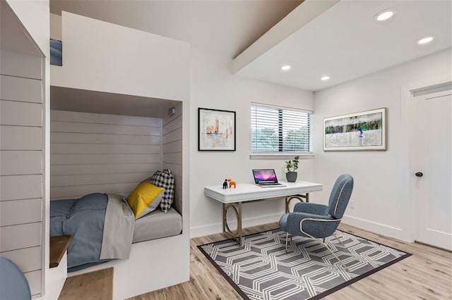 home office with light hardwood / wood-style floors