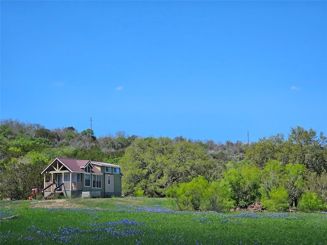 view of yard with a wooded view