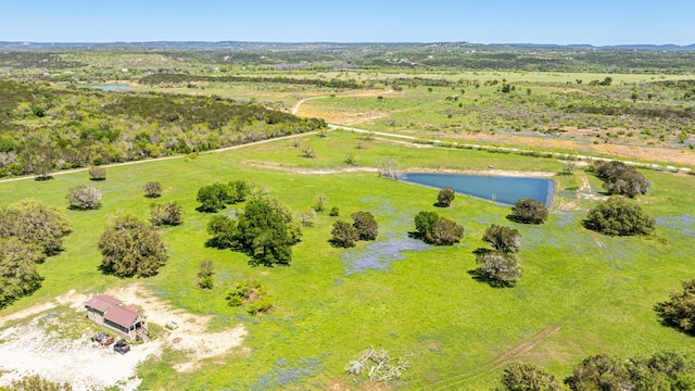 drone / aerial view with a rural view and a water view