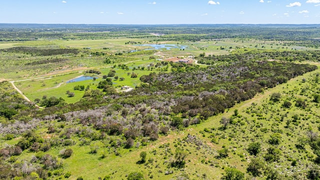 aerial view with a water view and a rural view