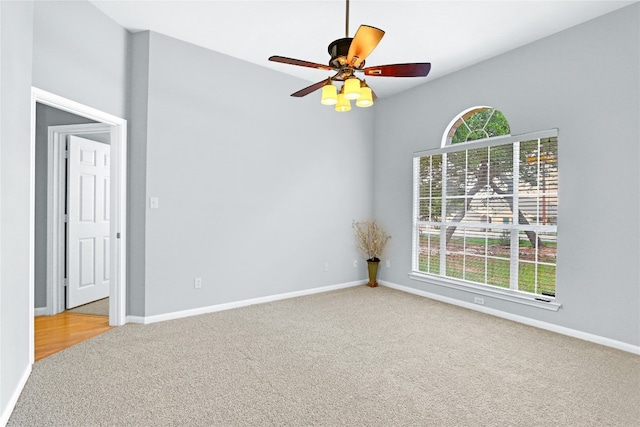 spare room with carpet and ceiling fan