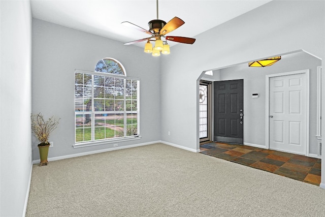 tiled foyer with ceiling fan