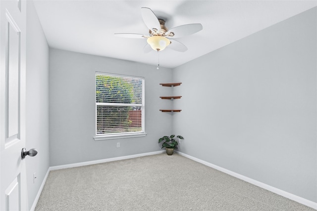 unfurnished room with carpet and ceiling fan