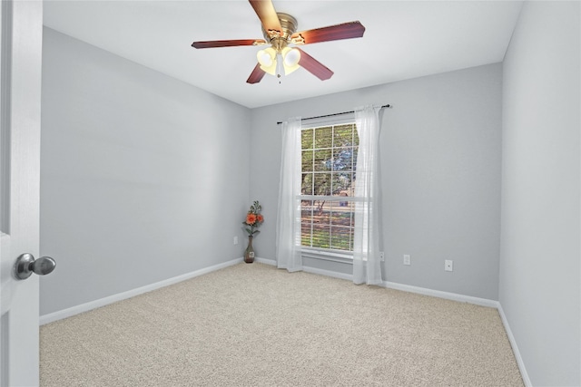 empty room with light carpet and ceiling fan