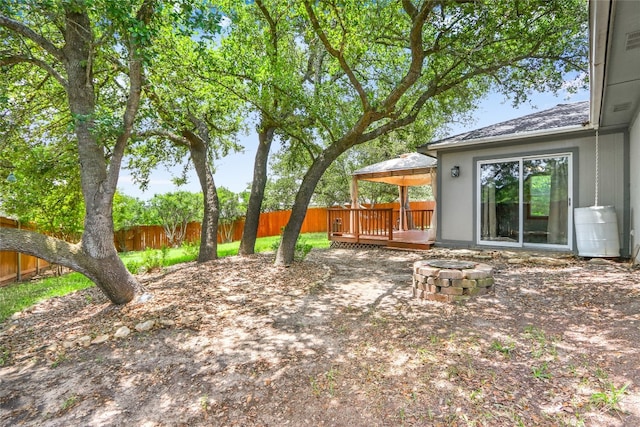 view of yard featuring a deck and a gazebo