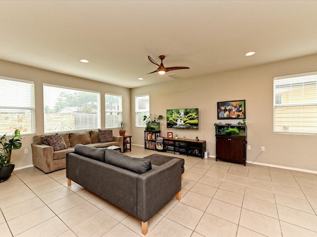 living room featuring ceiling fan and light tile floors