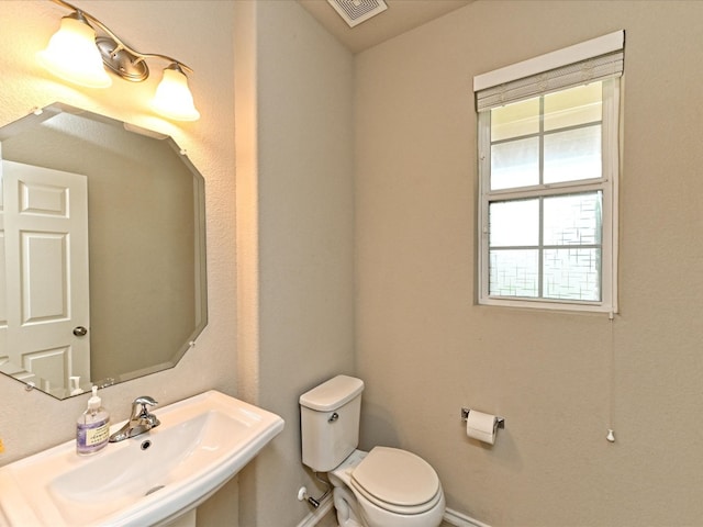 bathroom featuring sink and toilet