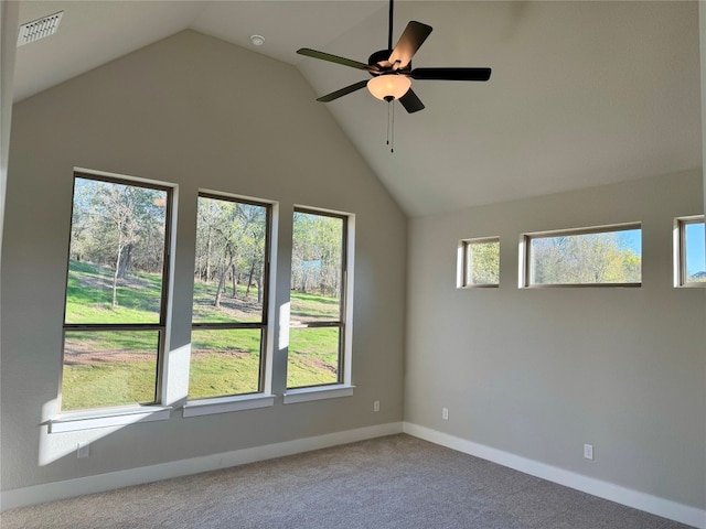 spare room featuring plenty of natural light, carpet floors, and lofted ceiling