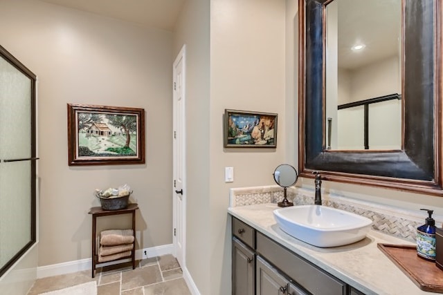 bathroom with tile flooring and vanity