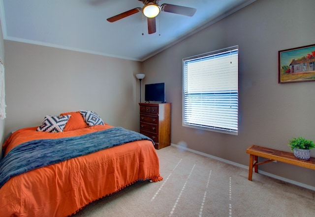 bedroom featuring ornamental molding, lofted ceiling, ceiling fan, and light colored carpet