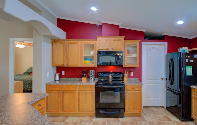 kitchen featuring black appliances, vaulted ceiling, ceiling fan, and ornamental molding