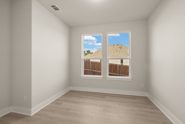 unfurnished room featuring light hardwood / wood-style flooring