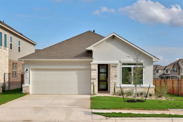 view of front facade featuring a garage and a front yard