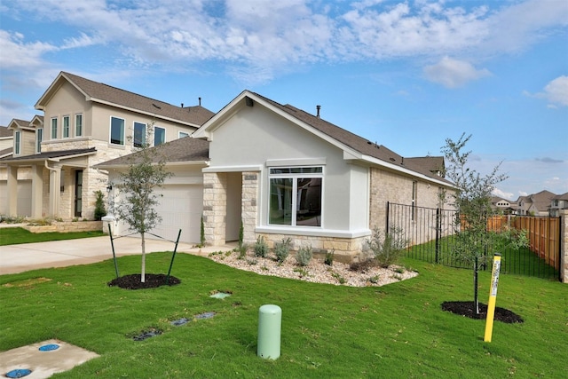 view of front of home featuring a front yard and a garage