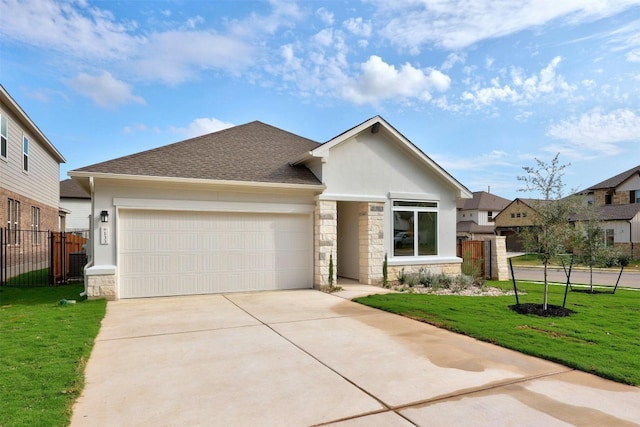 view of front of house featuring a front lawn and a garage