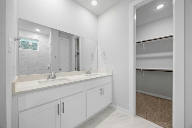 bathroom with a shower and vanity