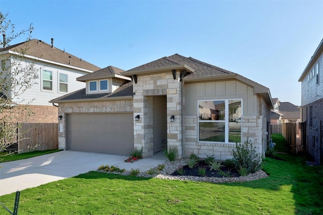 view of front of house featuring a front yard and a garage