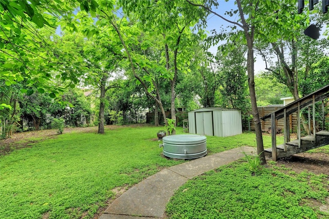 view of yard with a storage unit