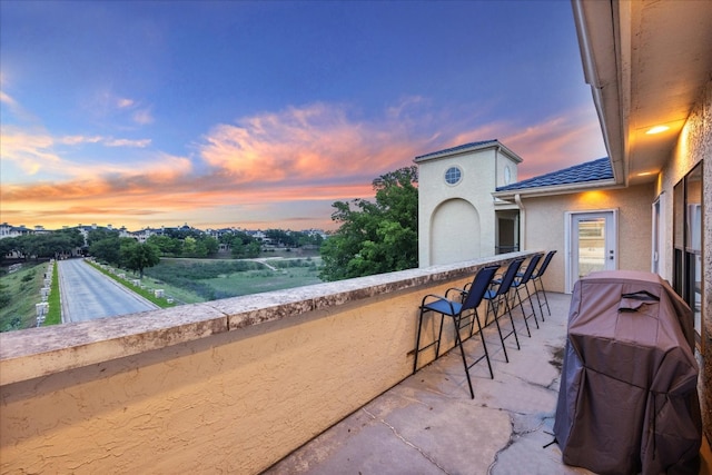 view of patio terrace at dusk