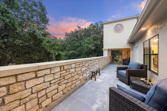 patio terrace at dusk with an outdoor hangout area