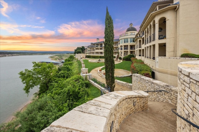 surrounding community featuring a water view