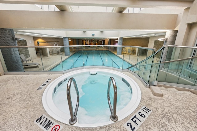 view of pool featuring an indoor hot tub