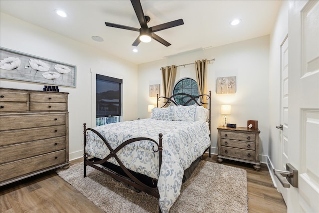 bedroom featuring hardwood / wood-style flooring and ceiling fan