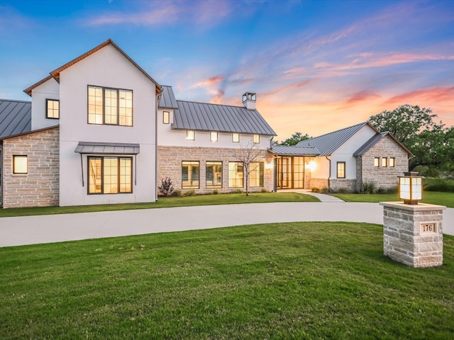 view of front of home with a lawn