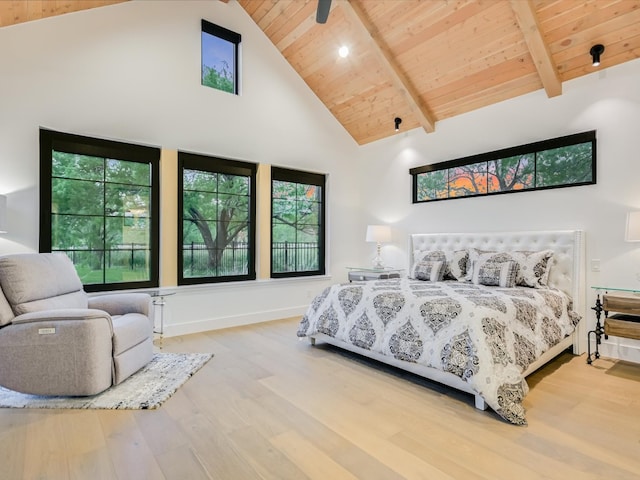 bedroom featuring wooden ceiling, hardwood / wood-style flooring, beam ceiling, high vaulted ceiling, and ceiling fan