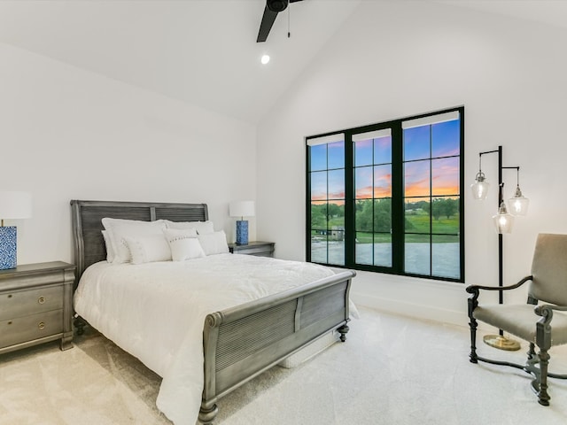 bedroom with high vaulted ceiling, ceiling fan, and carpet flooring